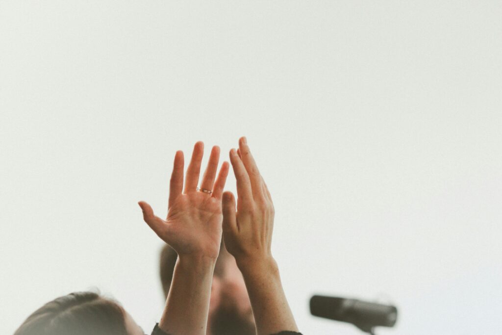 Hands raised in prayer and worship to God